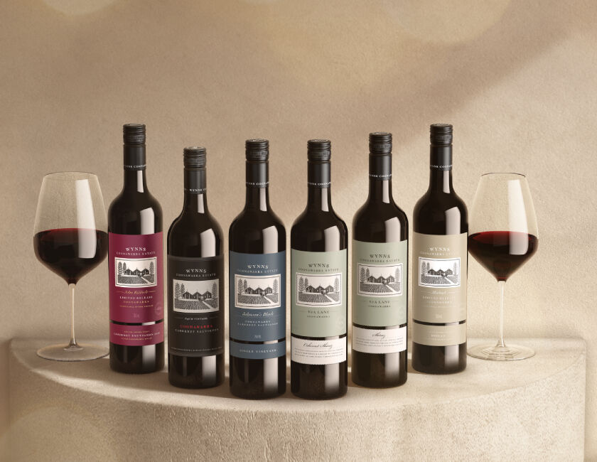 6 bottles of Wynns Wines displayed with two red wine glasses